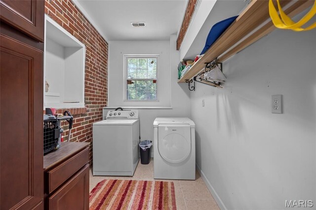 2785 Marble Springs Rd, Barnhart, MO 63012 - laundry area featuring separate washer and dryer and brick wall