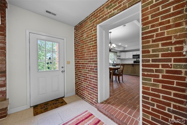 2785 Marble Springs Rd, Barnhart, MO 63012 - entrance foyer with baseboards, recessed lighting, and brick wall
