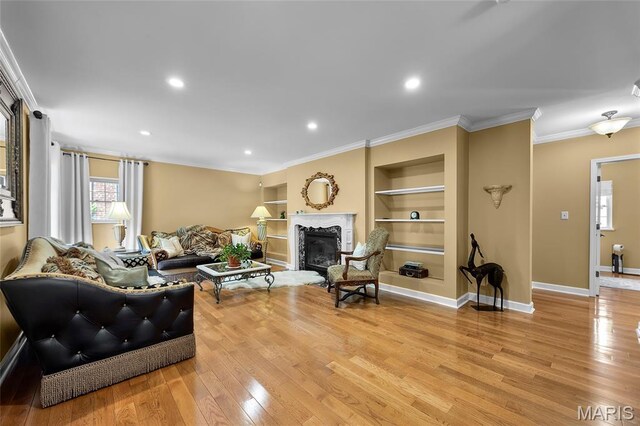 2785 Marble Springs Rd, Barnhart, MO 63012 - living room with light wood-style floors, a high end fireplace, ornamental molding, built in features, and baseboards