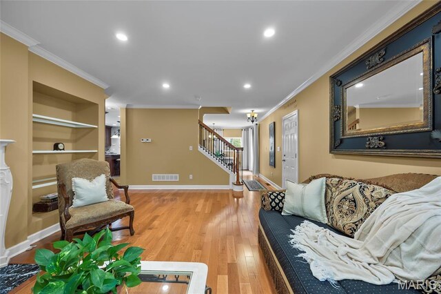 2785 Marble Springs Rd, Barnhart, MO 63012 - living area with ornamental molding, stairway, wood finished floors, baseboards, and recessed lighting
