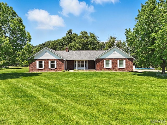 20731 Columbine Dr, Warrenton, MO 63383 - single story home with brick siding, a front yard, a chimney, and an outdoor pool
