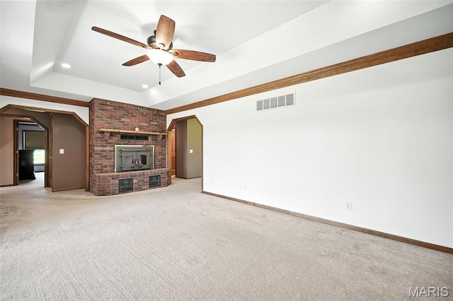 20731 Columbine Dr, Warrenton, MO 63383 - unfurnished living room with a ceiling fan, light carpet, recessed lighting, and a tray ceiling