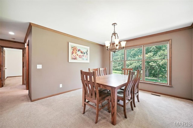 20731 Columbine Dr, Warrenton, MO 63383 - dining space featuring crown molding, light colored carpet, and a chandelier