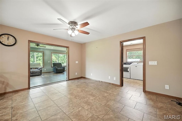20731 Columbine Dr, Warrenton, MO 63383 - empty room with washing machine and clothes dryer, ceiling fan, and plenty of natural light