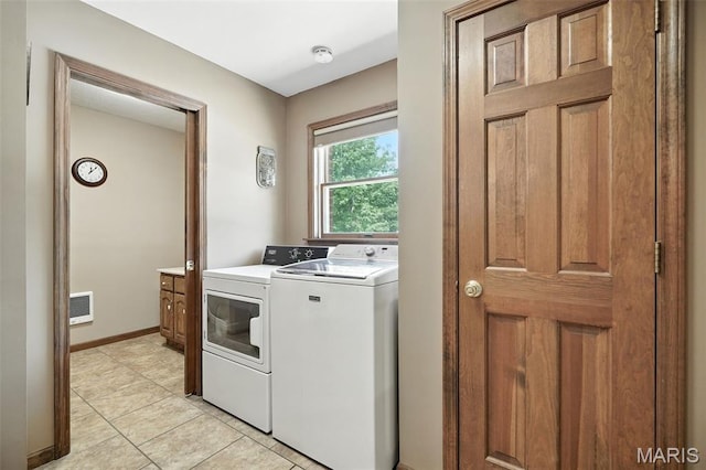 20731 Columbine Dr, Warrenton, MO 63383 - laundry room featuring washing machine and dryer and light tile patterned floors