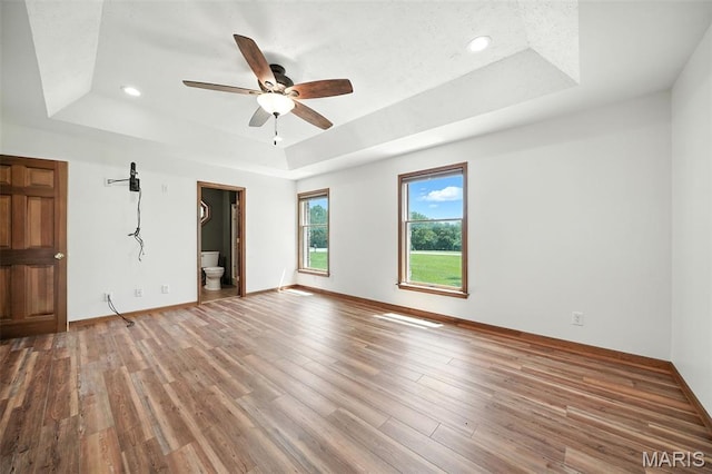 20731 Columbine Dr, Warrenton, MO 63383 - empty room featuring a raised ceiling, a ceiling fan, wood finished floors, and recessed lighting