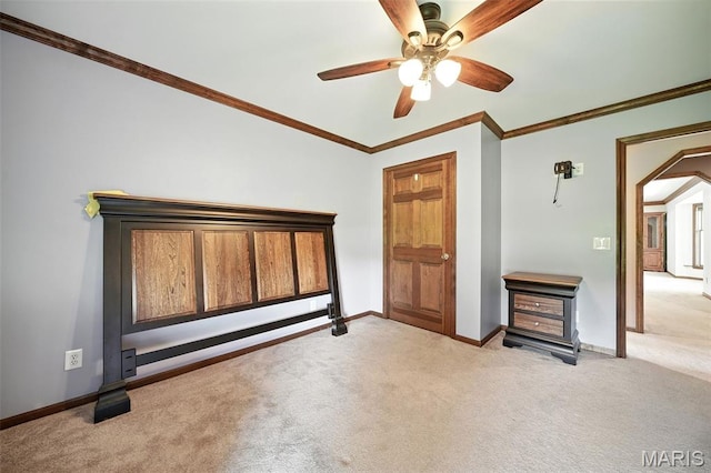 20731 Columbine Dr, Warrenton, MO 63383 - unfurnished bedroom featuring light carpet, arched walkways, crown molding, and ceiling fan