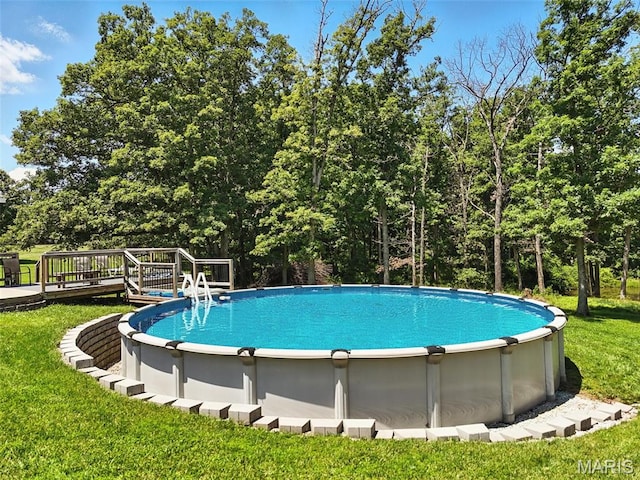 20731 Columbine Dr, Warrenton, MO 63383 - swimming pool with a yard and a wooden deck