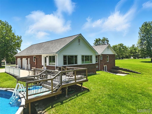 20731 Columbine Dr, Warrenton, MO 63383 - rear view of property featuring brick siding, a lawn, an attached garage, and a wooden deck