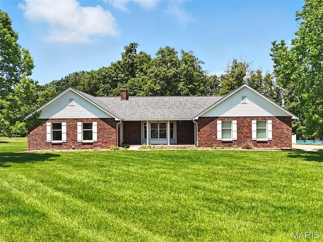 20731 Columbine Dr, Warrenton, MO 63383 - single story home with a front yard, a chimney, brick siding, and an outdoor pool
