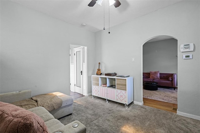 4444 Taft Ave, Saint Louis, MO 63116 - carpeted living room with arched walkways, ceiling fan, and baseboards