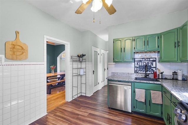 4444 Taft Ave, Saint Louis, MO 63116 - kitchen featuring stainless steel appliances, tile walls, green cabinets, a sink, and a ceiling fan