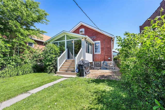 4444 Taft Ave, Saint Louis, MO 63116 - view of front of house with a sunroom and brick siding