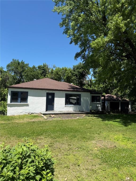 9915 N Rd, Fairview Heights, IL 62208 - back of property with a lawn and stucco siding