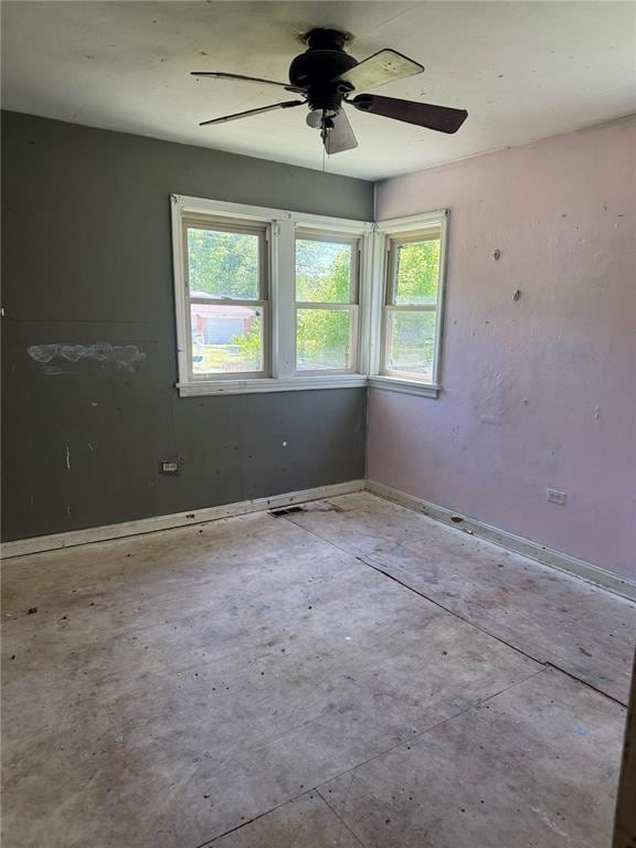 9915 N Rd, Fairview Heights, IL 62208 - empty room featuring ceiling fan and baseboards