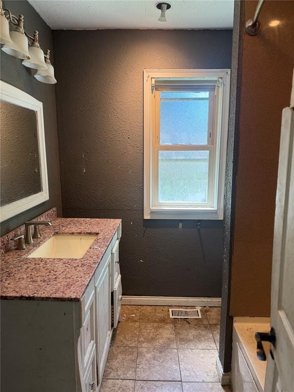 9915 N Rd, Fairview Heights, IL 62208 - bathroom featuring vanity, baseboards, and tile patterned flooring