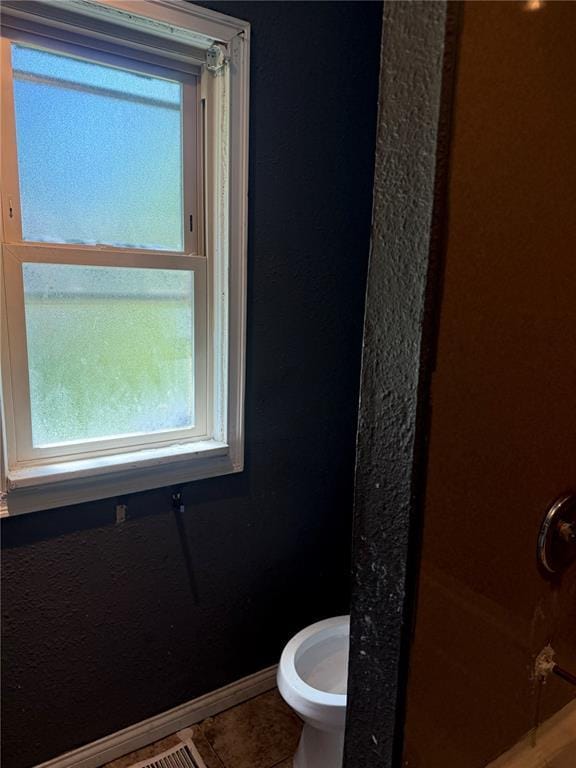 9915 N Rd, Fairview Heights, IL 62208 - bathroom featuring baseboards, tile patterned flooring, and toilet