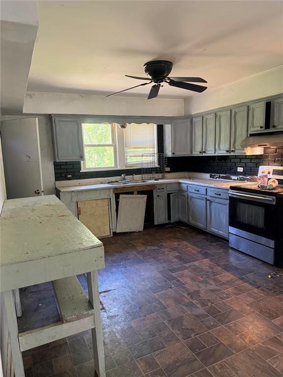 9915 N Rd, Fairview Heights, IL 62208 - kitchen with electric range oven, light countertops, decorative backsplash, and ceiling fan