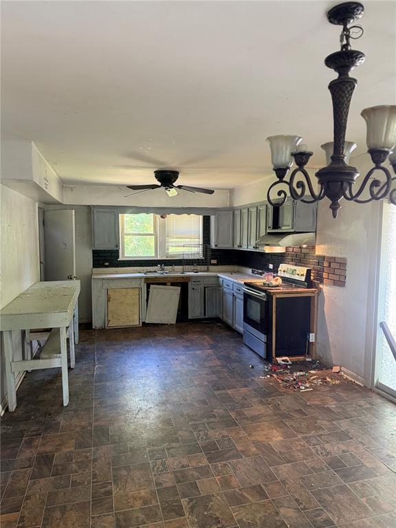 9915 N Rd, Fairview Heights, IL 62208 - kitchen with electric stove, dishwasher, a ceiling fan, backsplash, and gray cabinets