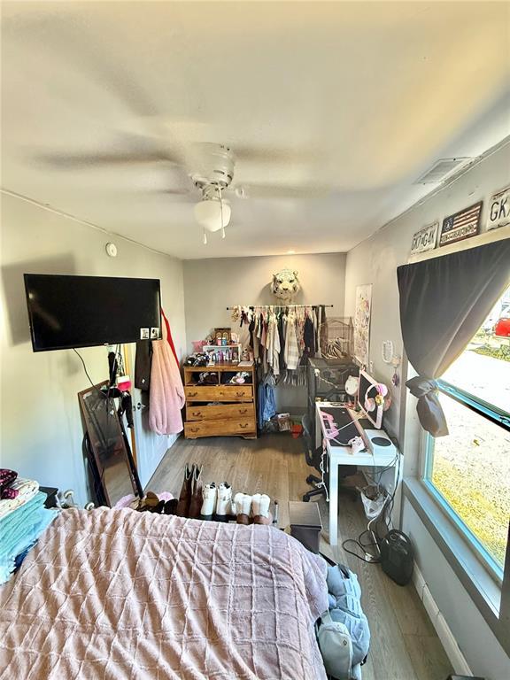 723 Ada St, Bismarck, MO 63624 - bedroom featuring wood finished floors, ceiling fan, and baseboards
