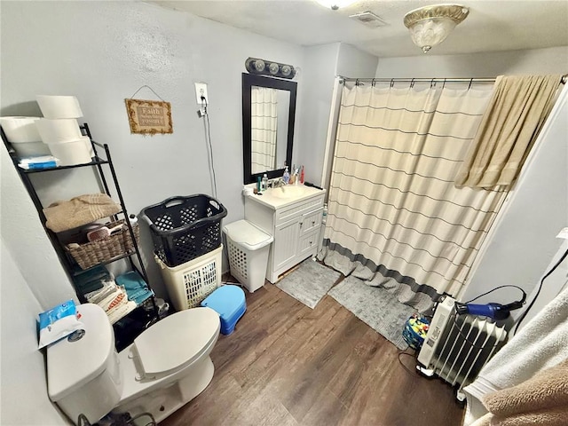 723 Ada St, Bismarck, MO 63624 - bathroom featuring wood finished floors, toilet, a shower with shower curtain, and vanity