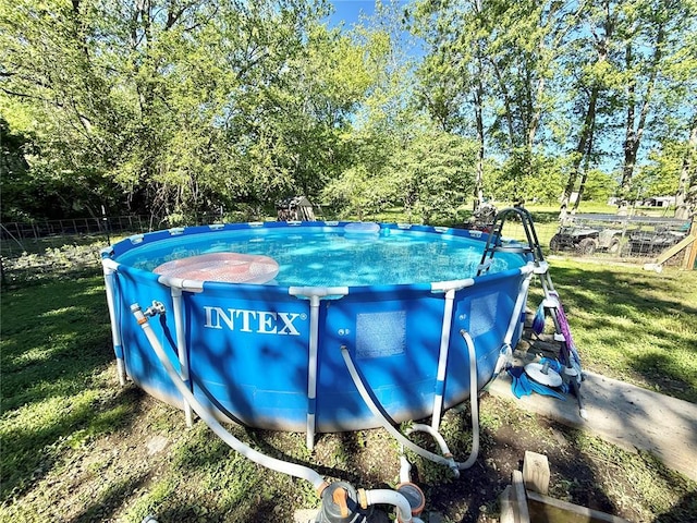 723 Ada St, Bismarck, MO 63624 - outdoor pool featuring a lawn and view of scattered trees