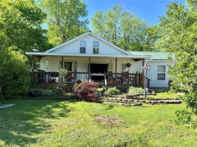723 Ada St, Bismarck, MO 63624 - view of front of property featuring board and batten siding, a porch, and a front lawn