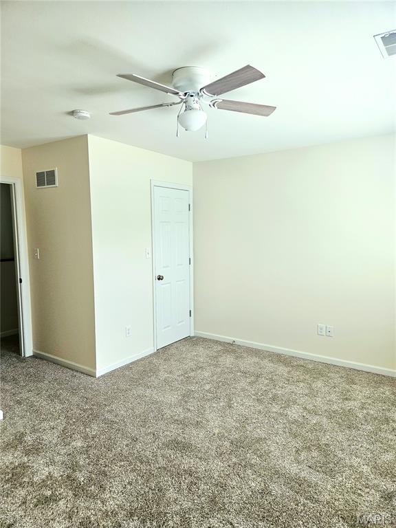 32 Loris Ln, Saint Charles, MO 63303 - carpeted empty room featuring ceiling fan and a smoke detector