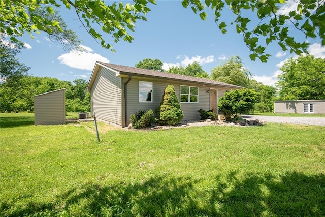 9268 Pin Oak Rd, Edwardsville, IL 62025 - ranch-style home featuring a front lawn, an outbuilding, and cooling unit
