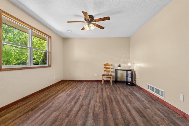 9268 Pin Oak Rd, Edwardsville, IL 62025 - empty room featuring wood finished floors, ceiling fan, baseboards, and a textured ceiling