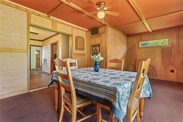 9268 Pin Oak Rd, Edwardsville, IL 62025 - carpeted dining space with a ceiling fan and wooden walls