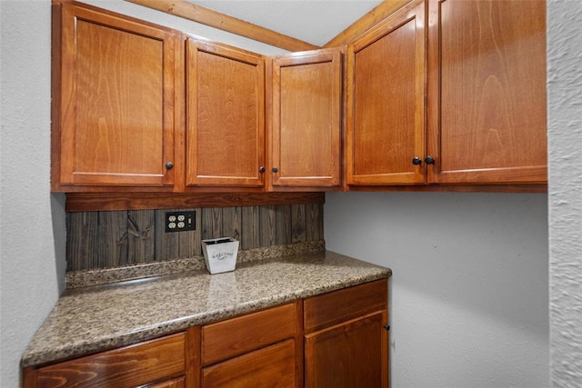 9268 Pin Oak Rd, Edwardsville, IL 62025 - kitchen featuring brown cabinetry and a textured wall