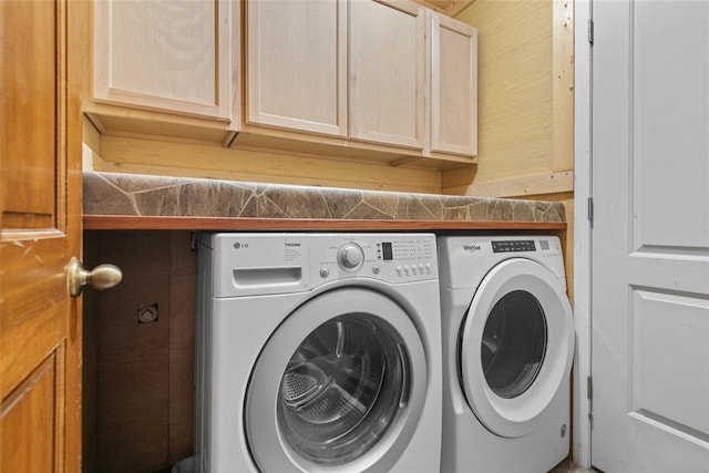 9268 Pin Oak Rd, Edwardsville, IL 62025 - laundry area with washing machine and clothes dryer and cabinet space