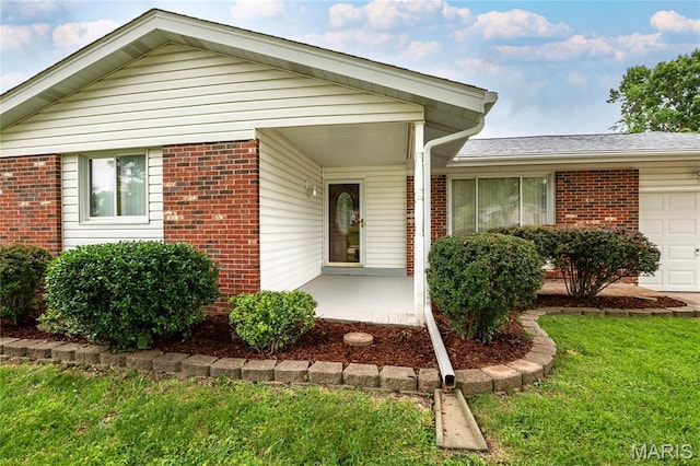 1968 Centurion Dr, Fenton, MO 63026 - view of front facade with brick siding, a garage, a front yard, and roof with shingles