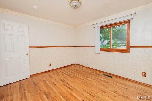 1968 Centurion Dr, Fenton, MO 63026 - spare room with light wood-type flooring, wallpapered walls, a wainscoted wall, baseboards, and a smoke detector