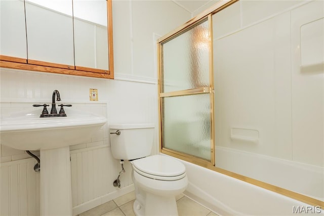 1968 Centurion Dr, Fenton, MO 63026 - full bathroom featuring toilet, tile patterned floors, and bath / shower combo with glass door
