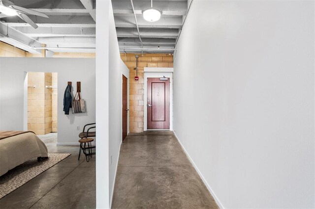 1720 Chouteau Ave Unit 303, Saint Louis, MO 63103 - corridor featuring finished concrete flooring and baseboards