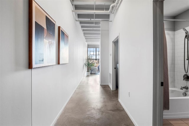 1720 Chouteau Ave Unit 303, Saint Louis, MO 63103 - hall featuring baseboards and finished concrete floors