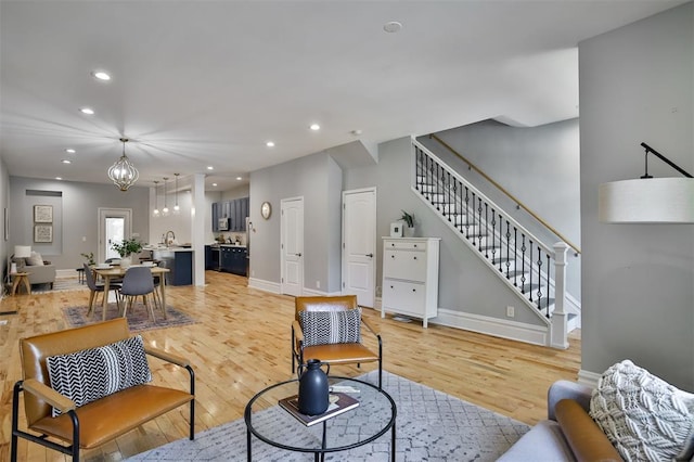 4412 Chouteau, Saint Louis, MO 63110 - living area featuring stairway, light wood-type flooring, recessed lighting, and baseboards