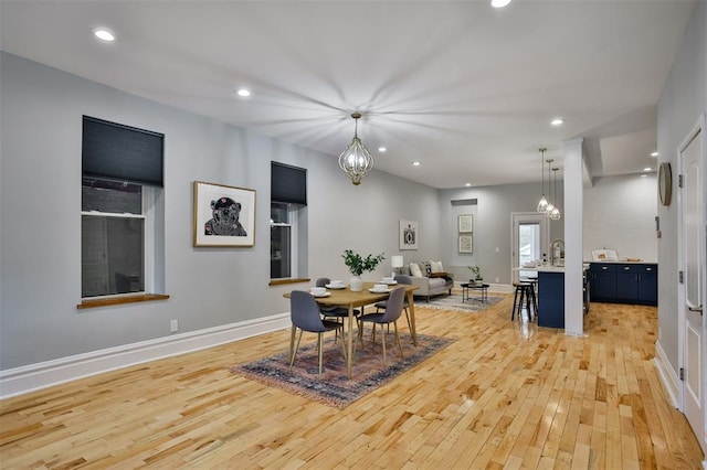 4412 Chouteau, Saint Louis, MO 63110 - dining room featuring light wood-style flooring, recessed lighting, baseboards, and a chandelier