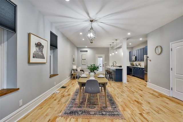 4412 Chouteau, Saint Louis, MO 63110 - dining room with light wood-type flooring, recessed lighting, baseboards, and a chandelier