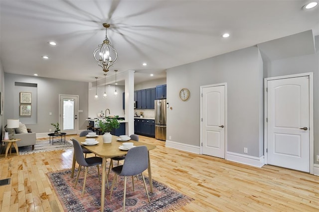 4412 Chouteau, Saint Louis, MO 63110 - dining space with light wood-style flooring, baseboards, recessed lighting, and a chandelier