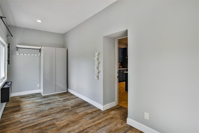 4412 Chouteau, Saint Louis, MO 63110 - unfurnished bedroom with baseboards, wood finished floors, and recessed lighting