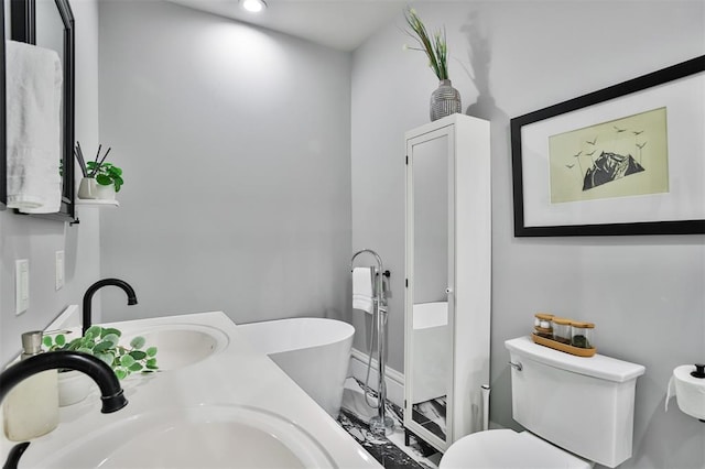 4412 Chouteau, Saint Louis, MO 63110 - full bath featuring a sink, a soaking tub, toilet, recessed lighting, and baseboards