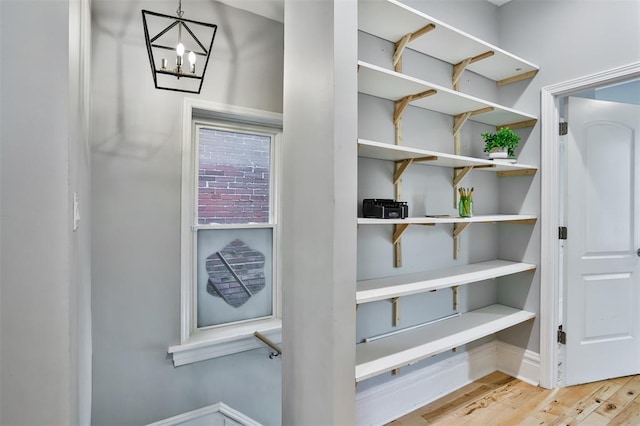 4412 Chouteau, Saint Louis, MO 63110 - detailed view of wood finished floors and a chandelier