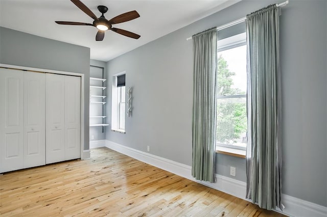4412 Chouteau, Saint Louis, MO 63110 - unfurnished bedroom featuring wood finished floors, a closet, baseboards, and ceiling fan