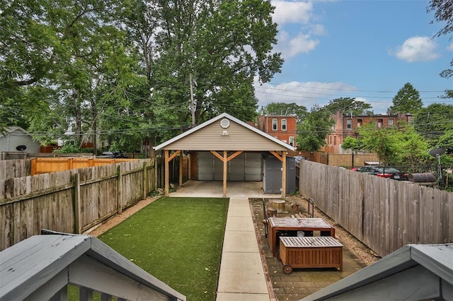 4412 Chouteau, Saint Louis, MO 63110 - view of yard with a garage and a vegetable garden