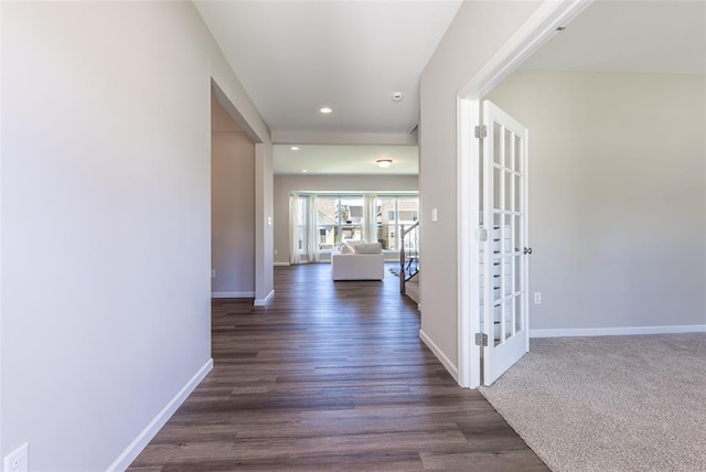 1051 Miremont Dr, Manchester, MO 63011 - hall featuring baseboards, french doors, recessed lighting, and dark wood-style flooring