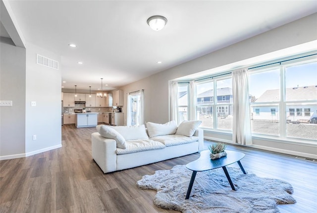 1051 Miremont Dr, Manchester, MO 63011 - living room with light wood-style floors, recessed lighting, and baseboards