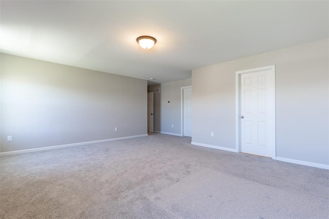 1051 Miremont Dr, Manchester, MO 63011 - empty room with baseboards and light colored carpet